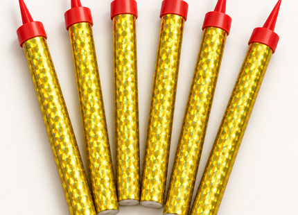 Close-up of six gold holographic fountain candles with red pointed bases