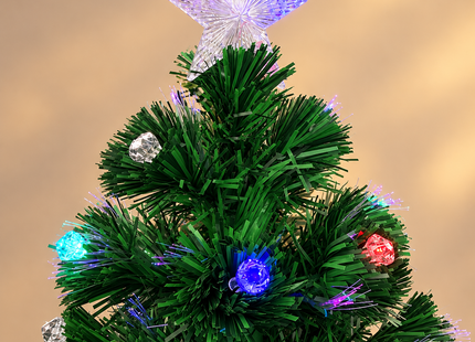 Illuminated star and lights on the upper branches